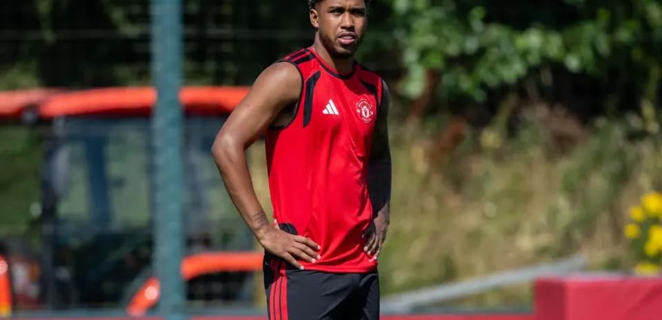 Player in red training kit at practice session