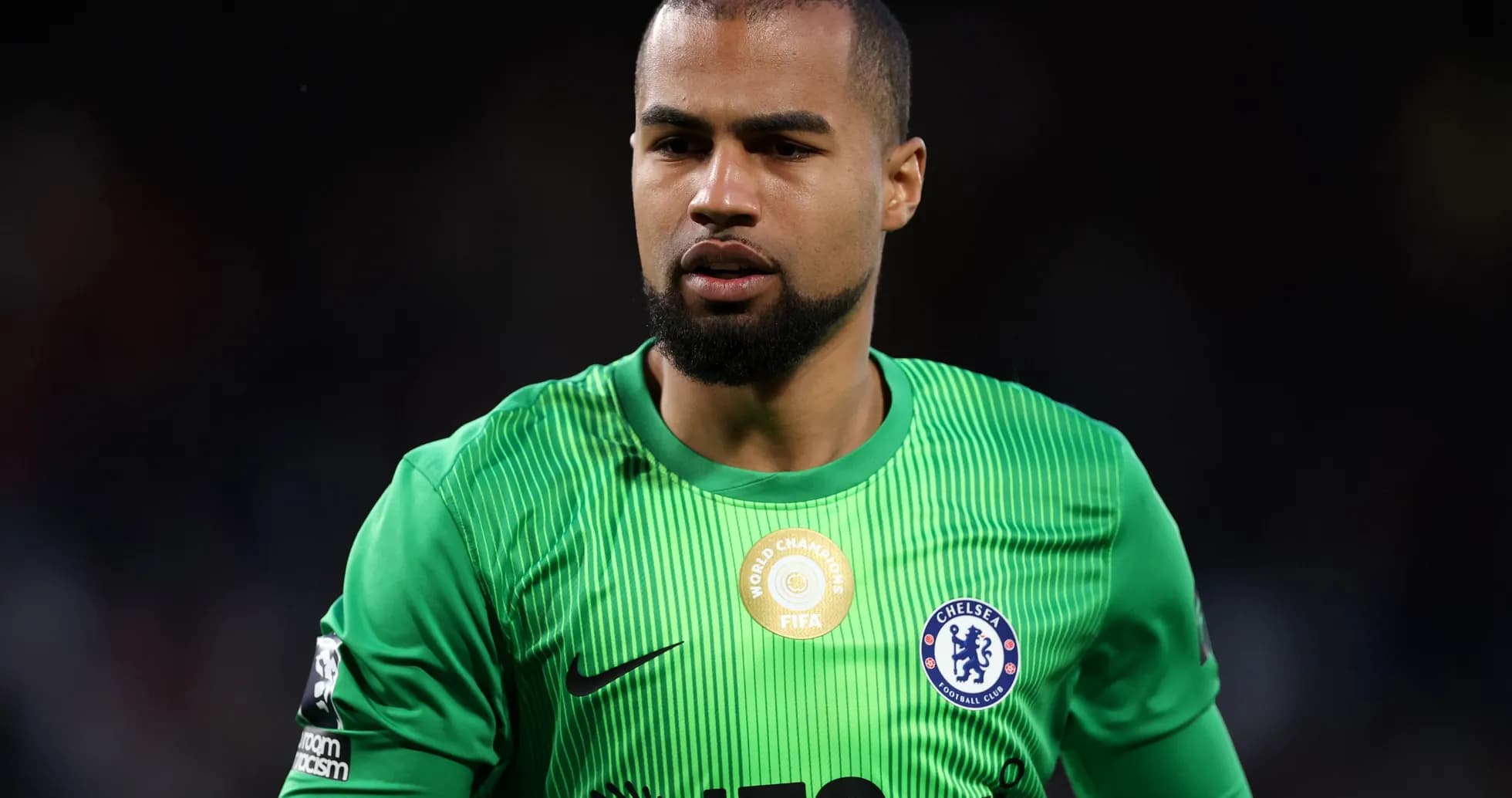 Goalkeeper in green jersey during match