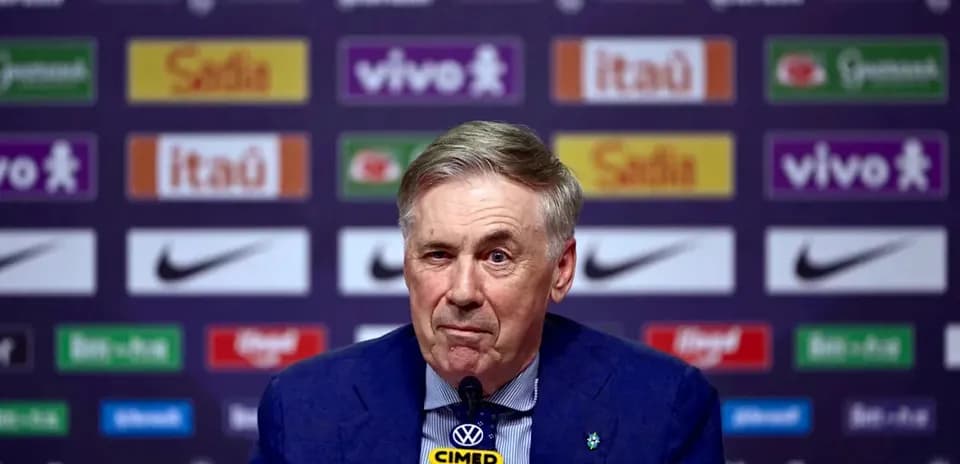 Manager at press conference with sponsor backdrop