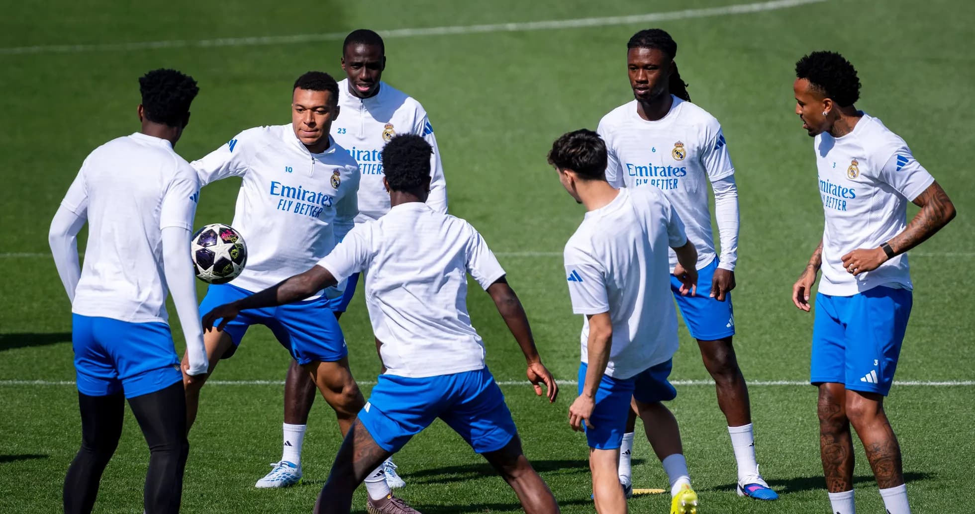 Real Madrid players practicing with a ball during training
