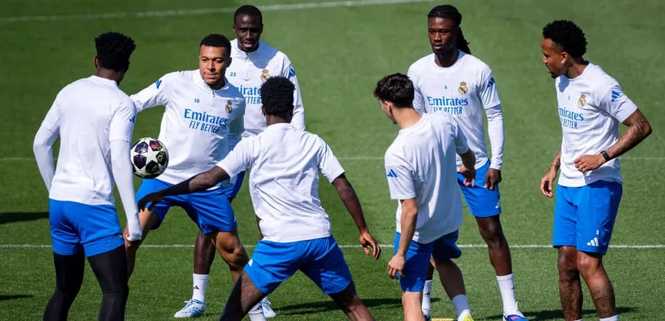 Real Madrid players practicing with a ball during training