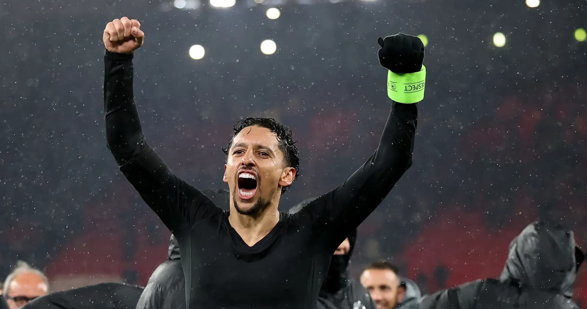Player celebrating victory in the rain