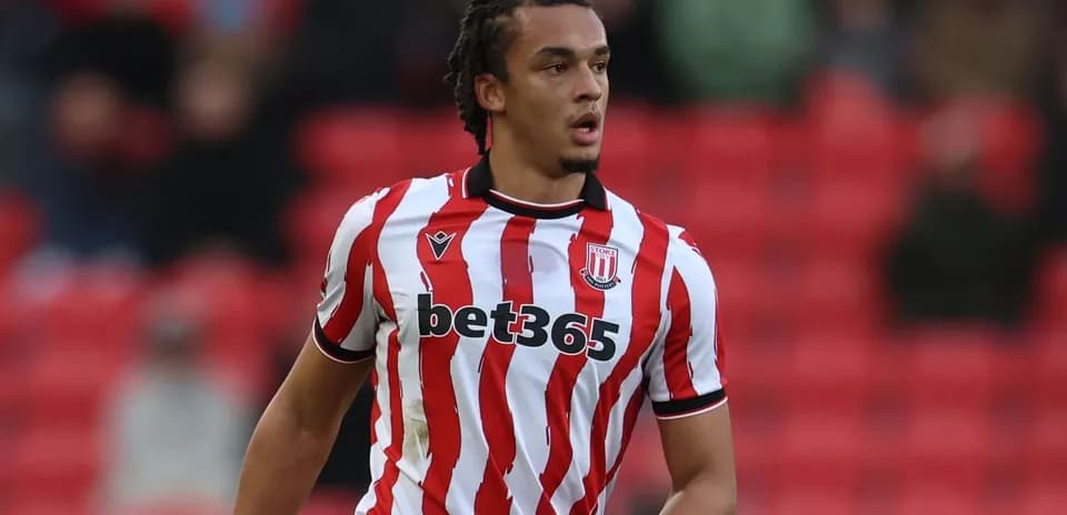 Player in Stoke City jersey during match action