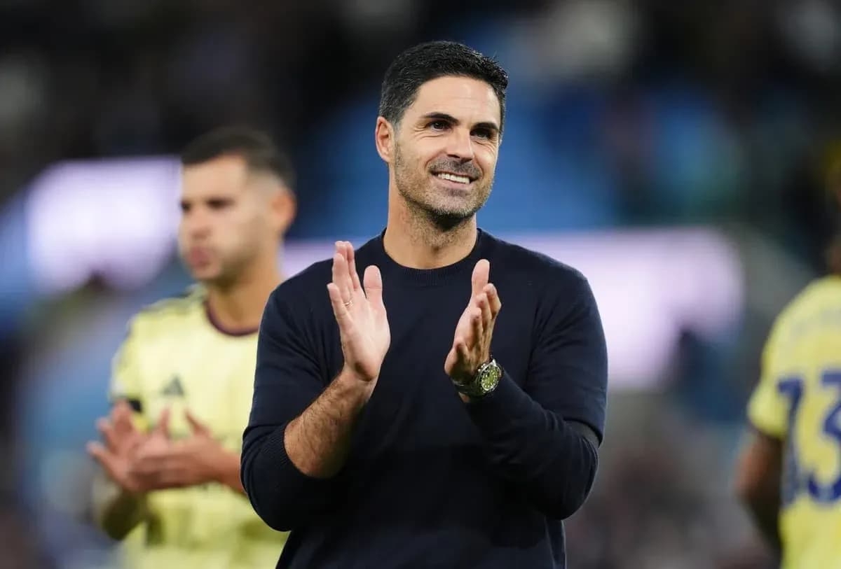 Manager clapping on the sidelines during match