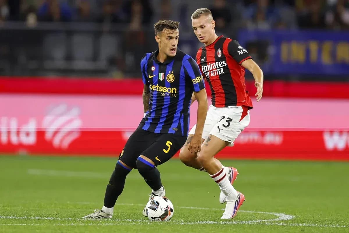 Inter Milan player dribbling past AC Milan defender