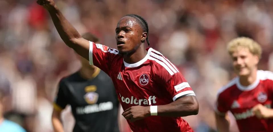 Player celebrating goal with raised finger during match