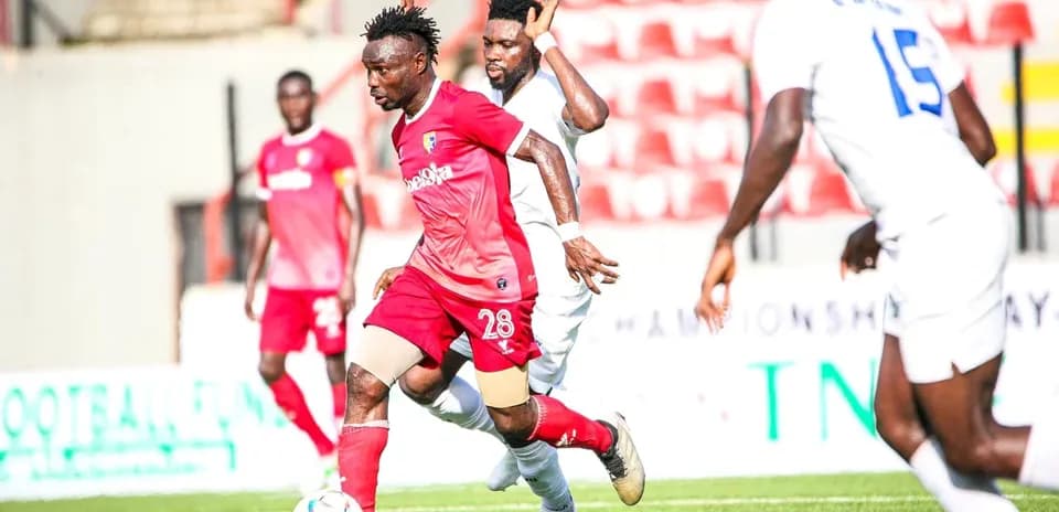 Katsina United player dribbling during match