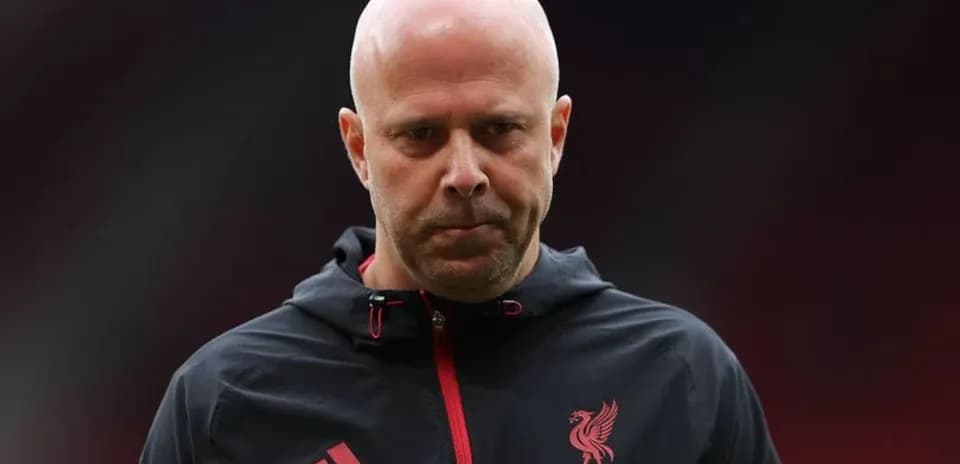Liverpool FC coach walking on the pitch