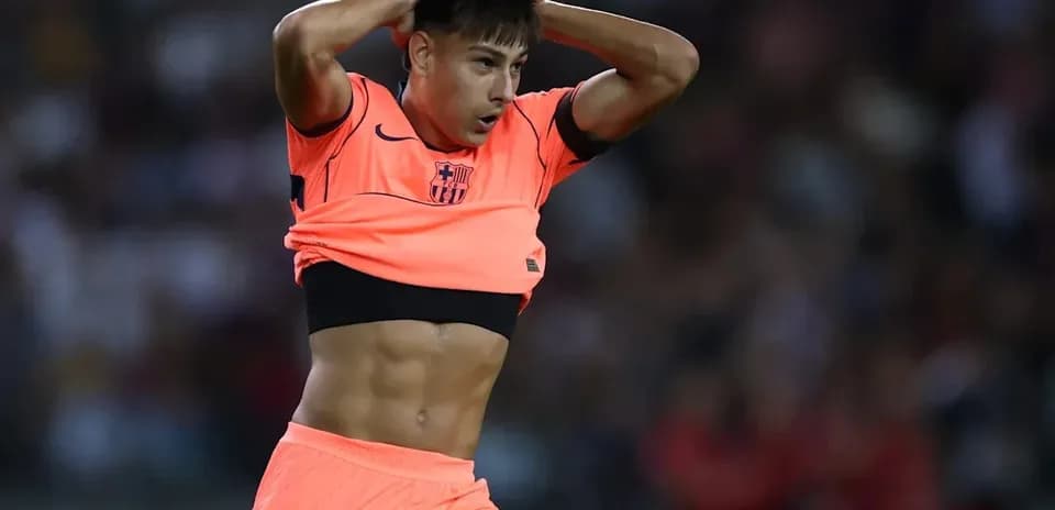 Player adjusting jersey during match on field