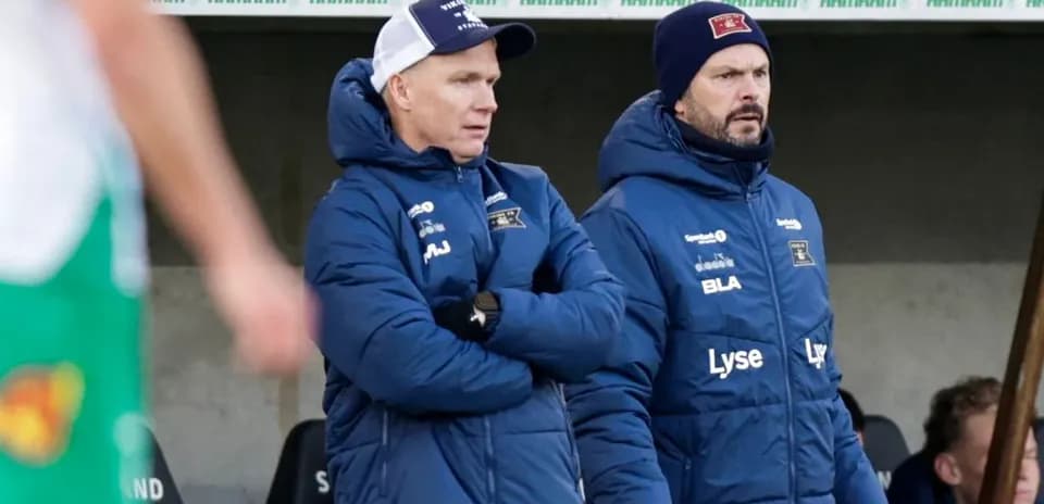 Coaches observing the match from the sideline
