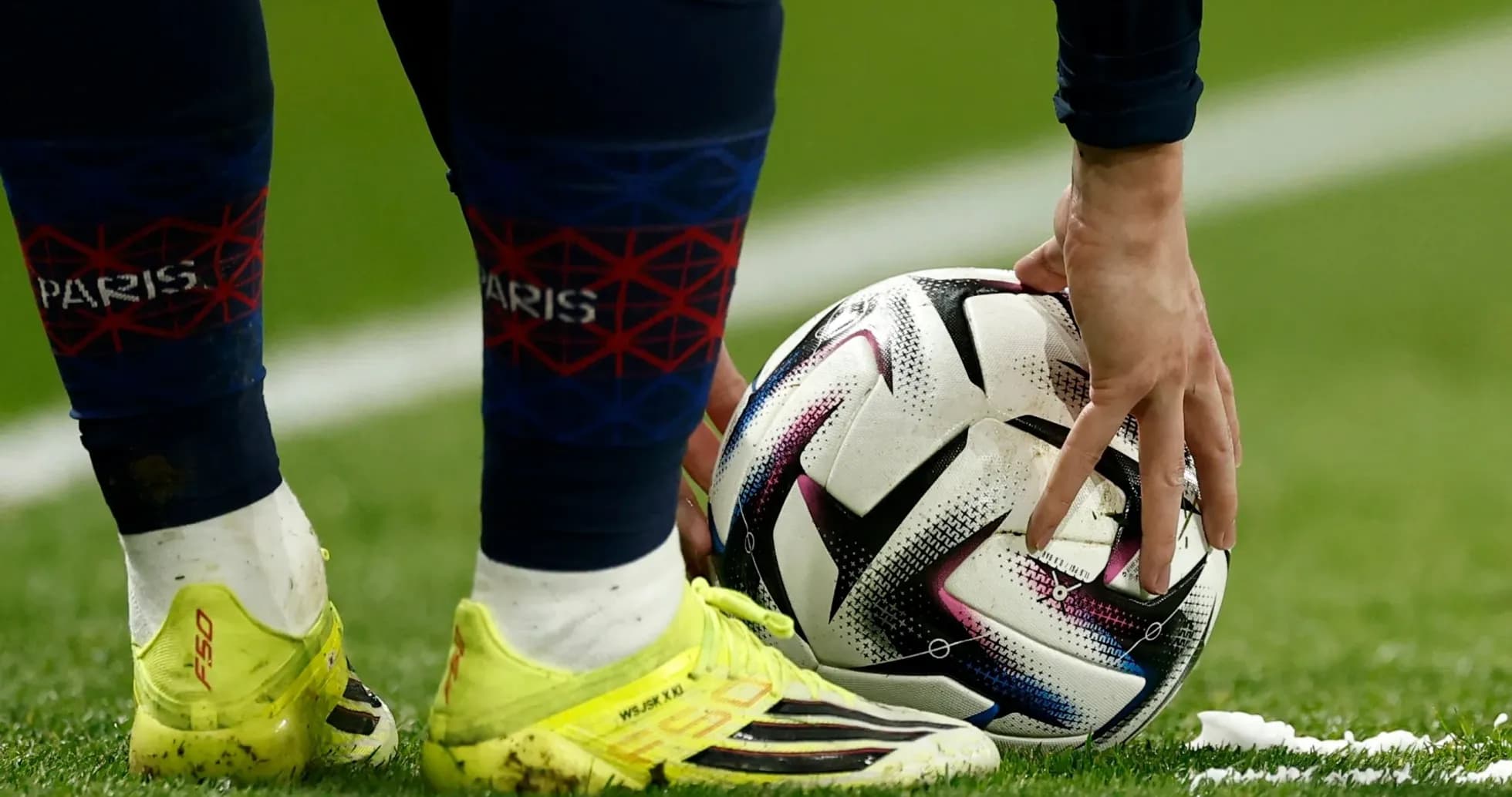 Player placing ball on the field before kick