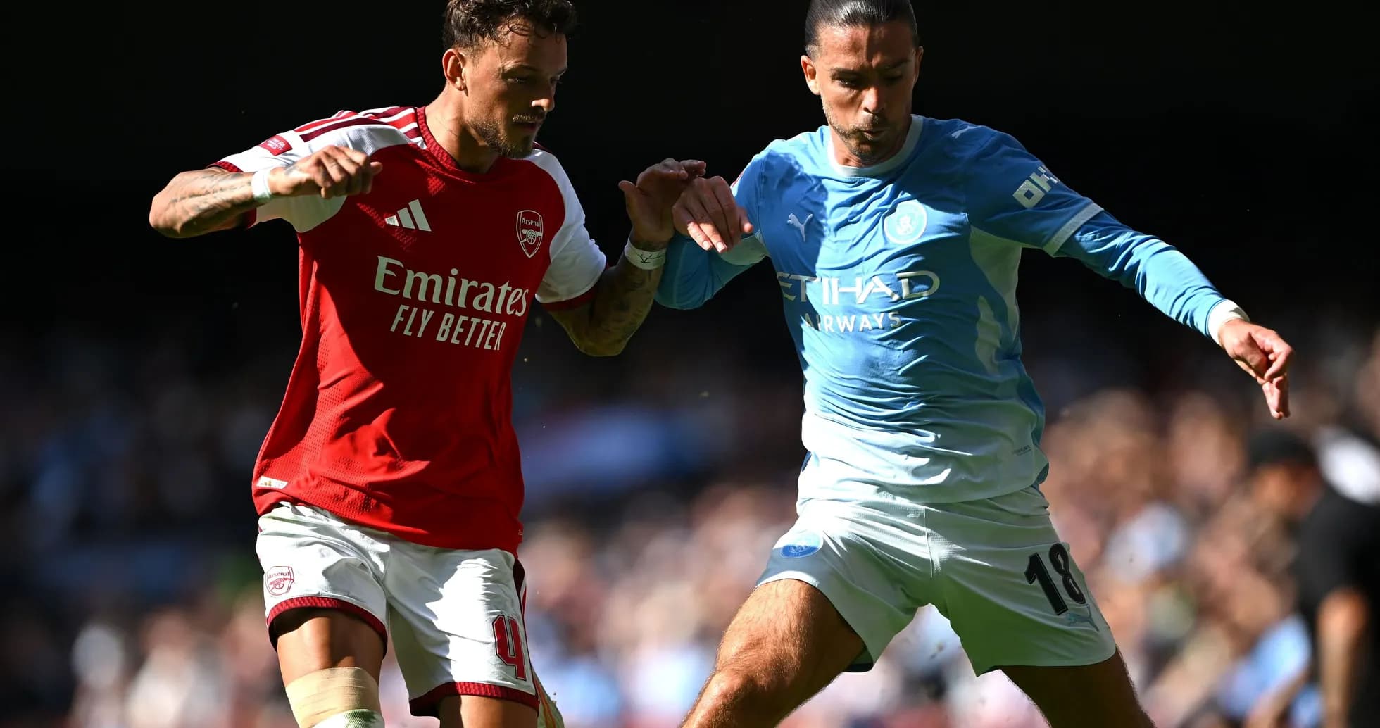 Two players contesting for the ball during match