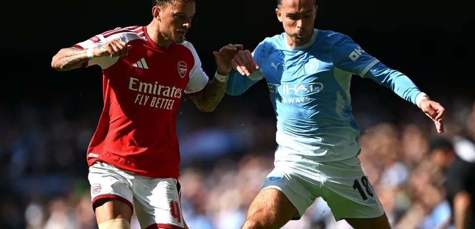 Two players contesting for the ball during match