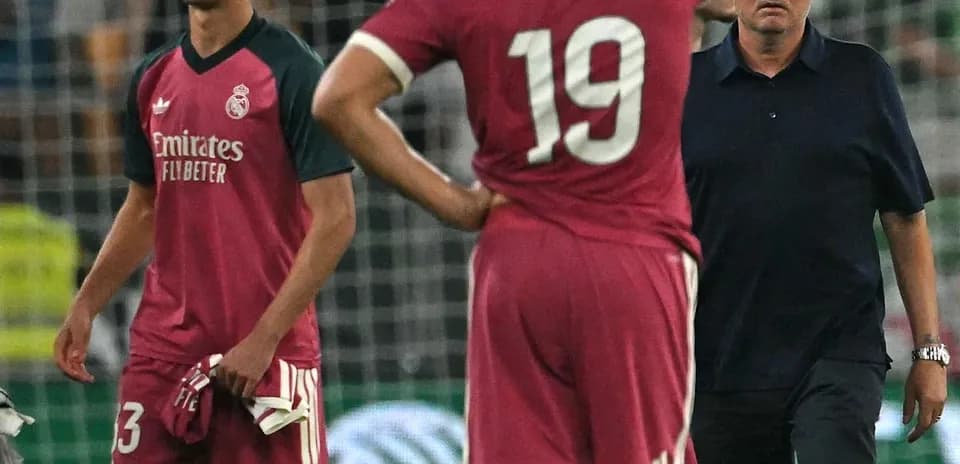 Players and coach reacting during match disappointment