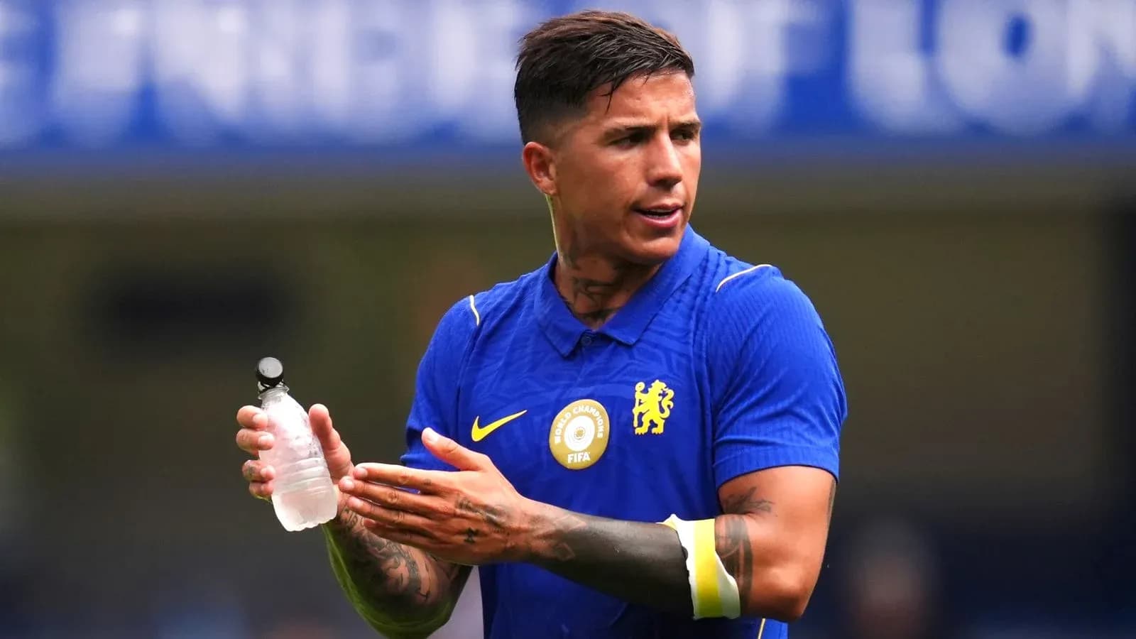 Player holding water bottle during training session