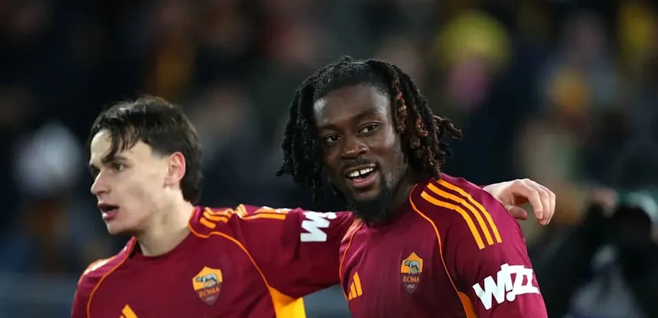 Two AS Roma players celebrating after a match