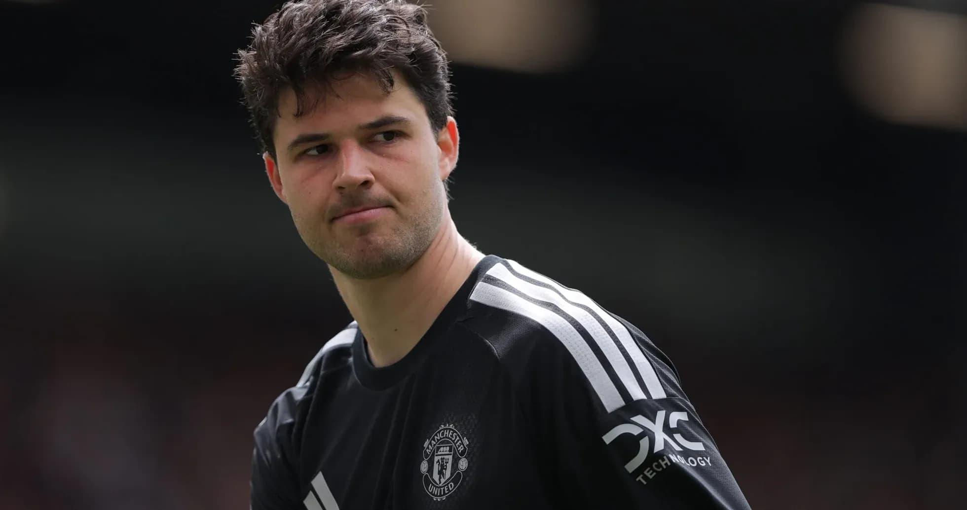 Goalkeeper in black kit preparing for match