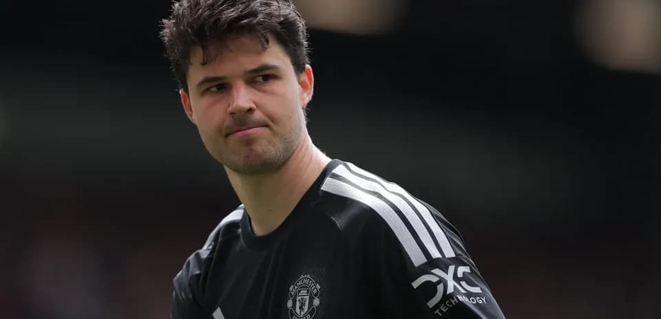 Goalkeeper in black kit preparing for match