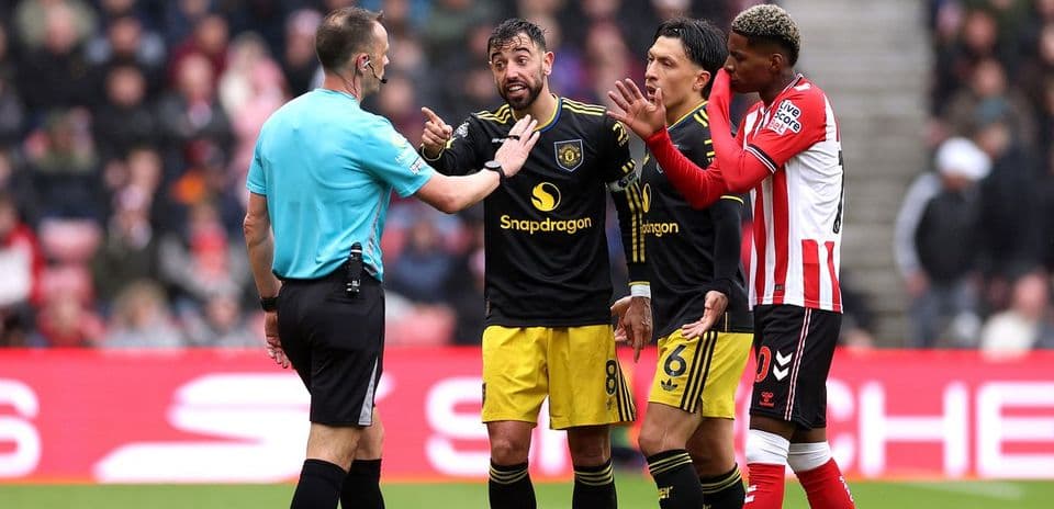 Players arguing with referee during match incident