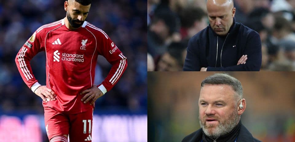 Liverpool player with head down, coaches in contemplation