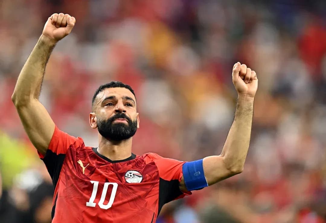 Egyptian player celebrating with raised arms on field