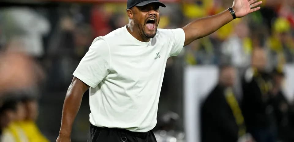 Coach gesturing passionately during a match