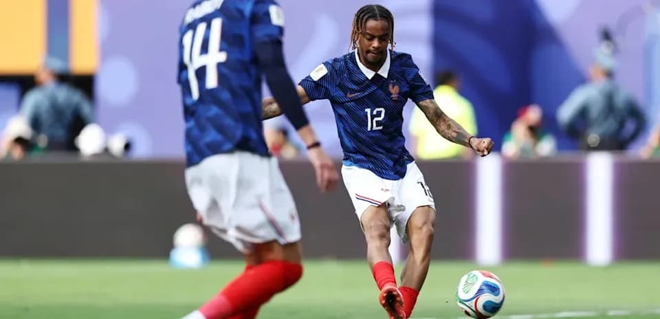 French player kicking ball during match