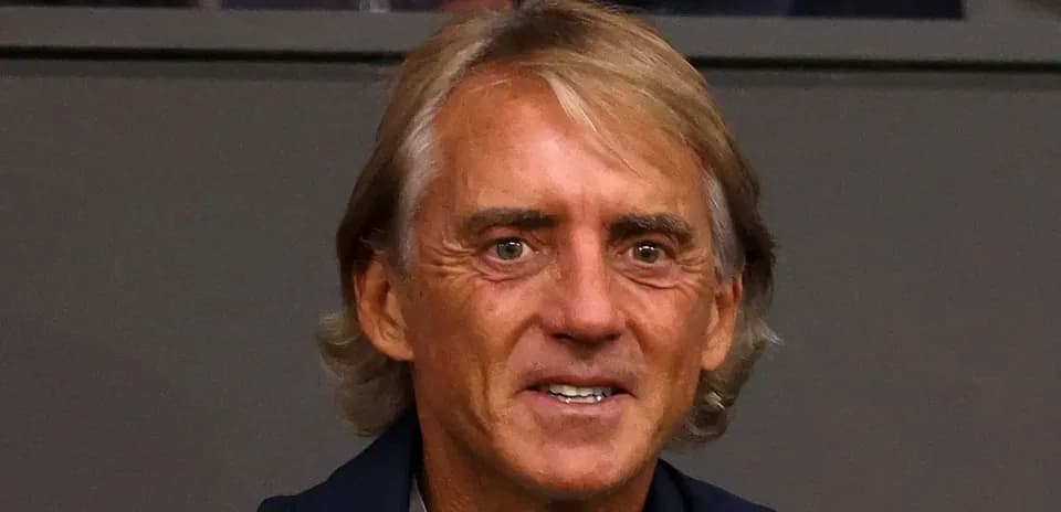 Coach smiling during a match observation