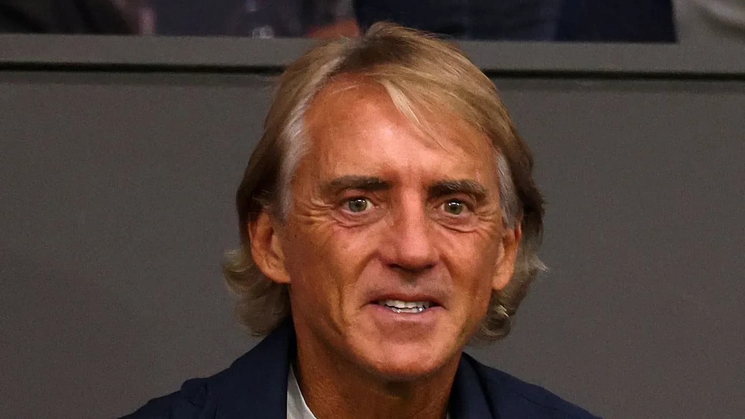 Coach smiling during a match observation