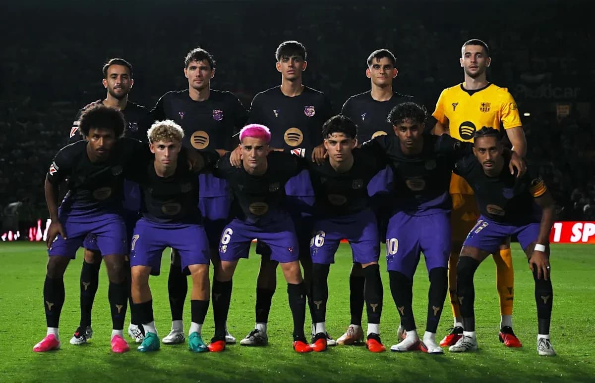 Football team posing for group photo on field