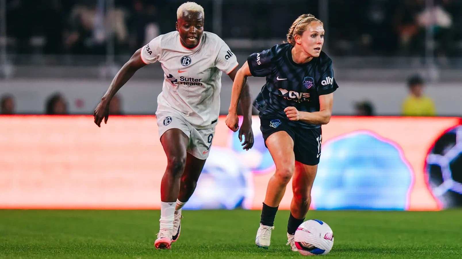 Players competing for the ball during match