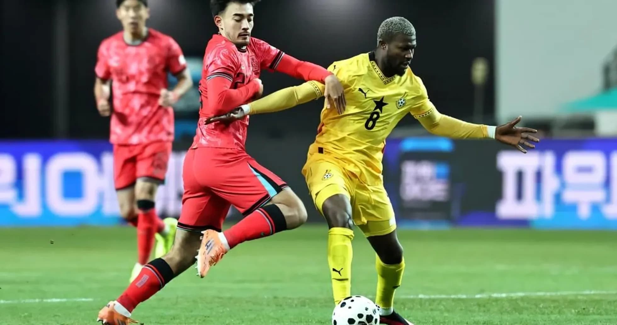Two players competing for the ball during match