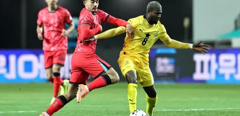 Two players competing for the ball during match