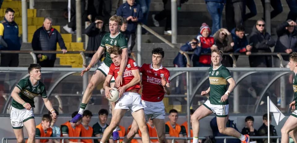 Players contesting a ball during a Gaelic football match