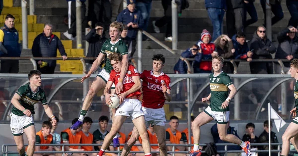 Players contesting a ball during a Gaelic football match