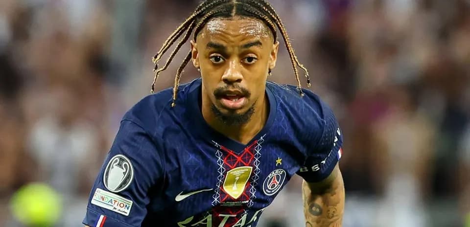 Player running with ball during match for PSG