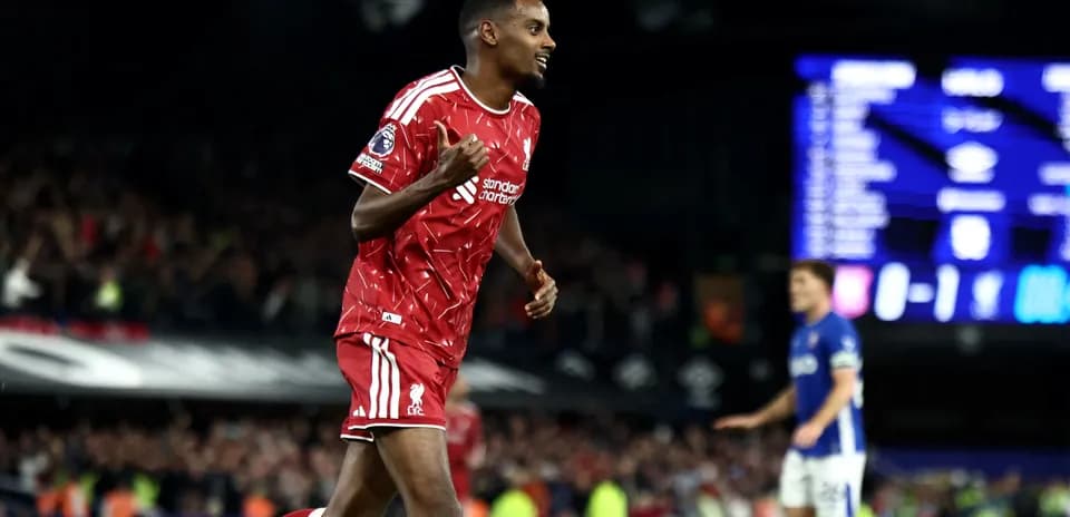 Player celebrating after scoring for Liverpool during match