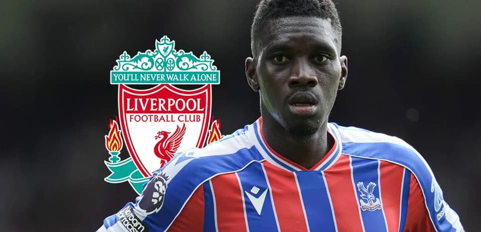 Player in Crystal Palace kit with Liverpool logo background