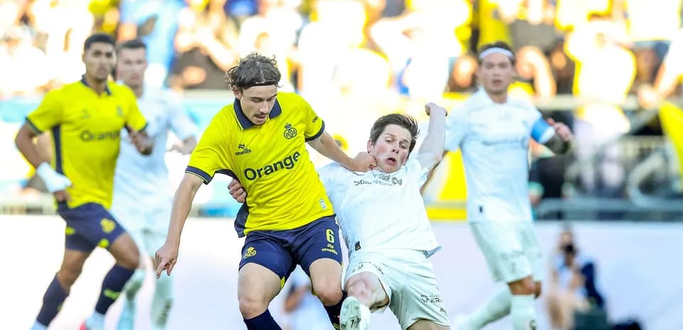 Bodo/Glimt player tackling Union St. Gilloise opponent