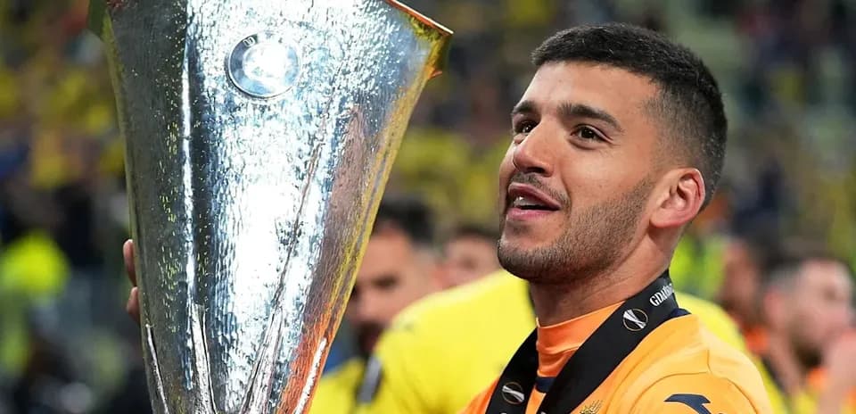 Player holding UEFA Europa League trophy after victory