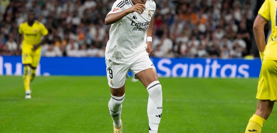 Player dribbling ball during match at stadium