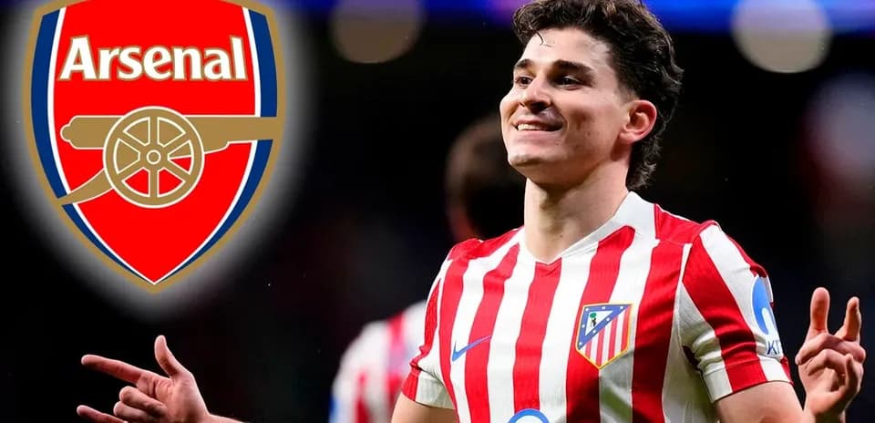 Atletico Madrid player celebrating with Arsenal logo