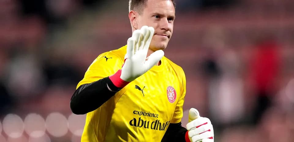Goalkeeper waving in yellow kit before match
