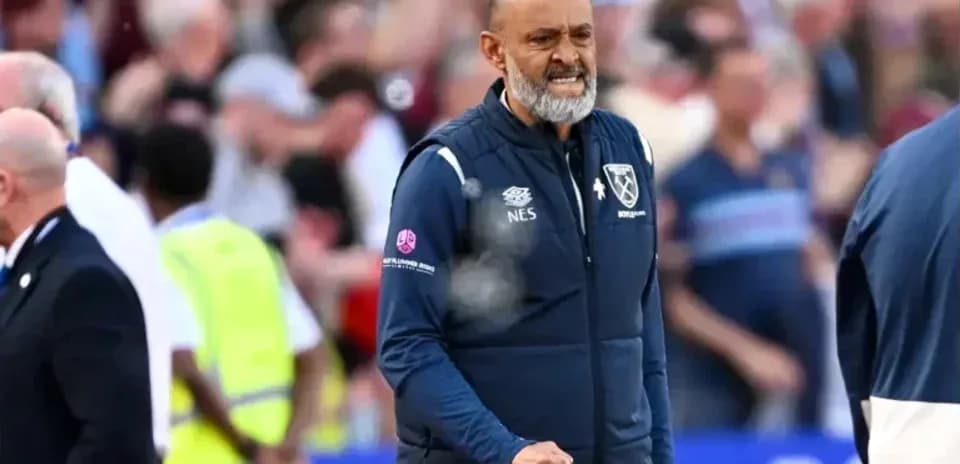 Manager celebrating on the sidelines during match