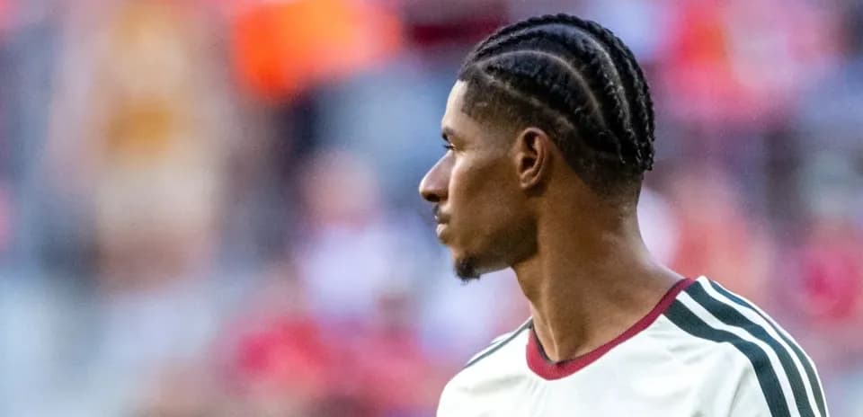 Player with braided hairstyle during match warm-up