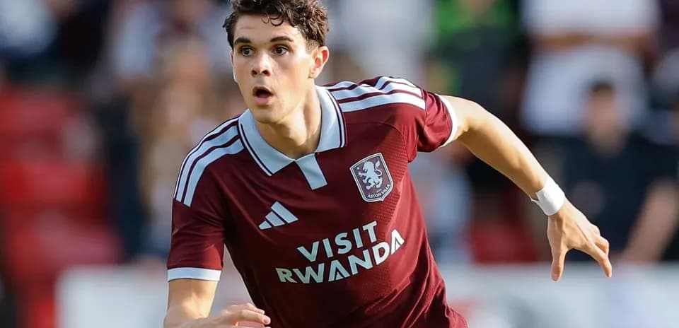 Player running during a football match for Aston Villa