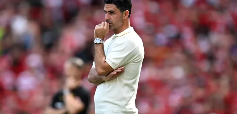 Coach observing the match with thoughtful expression