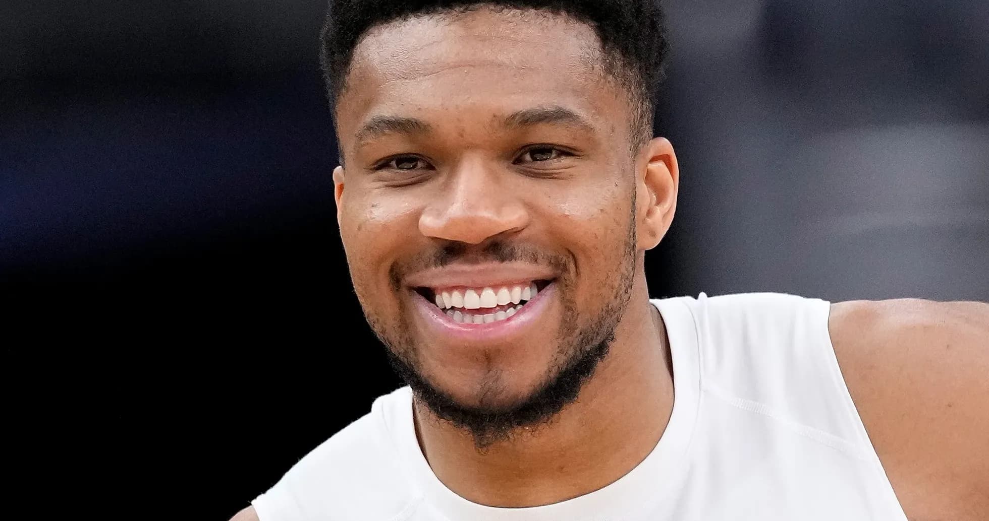 Smiling player during basketball warm-up session
