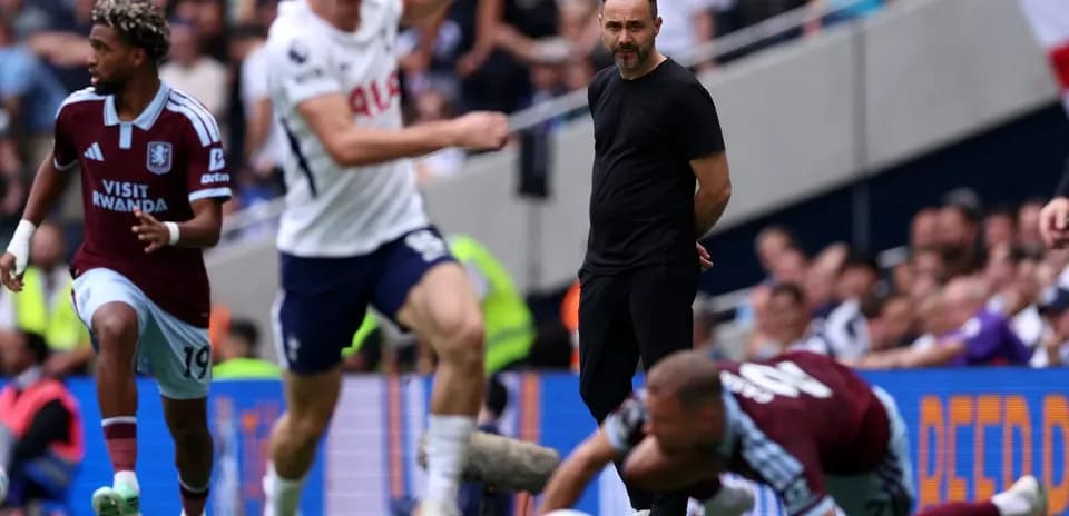 Aston Villa player dribbling past Tottenham coach during match
