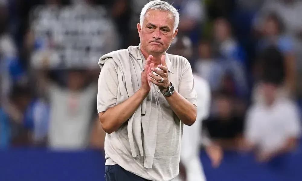 Coach applauding fans after the match